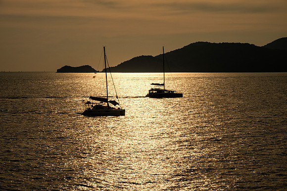 Silhouetted Catamarans Late Light 1