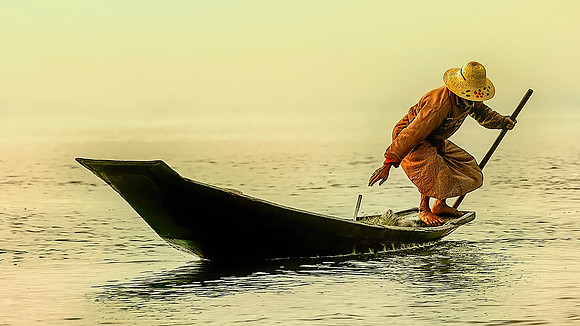 Balancing On the Back of a Sanpan Inle Lake Burma 26